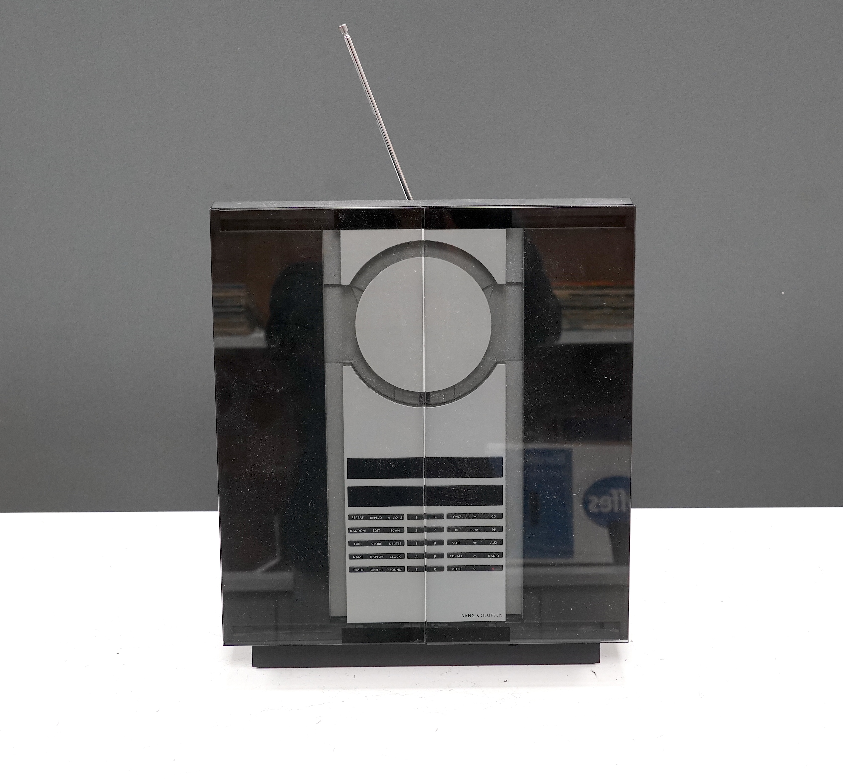A Bang & Olufsen BeoSound 3000 CD player and music system, 37cm high, with instruction booklet, cables and remote control
